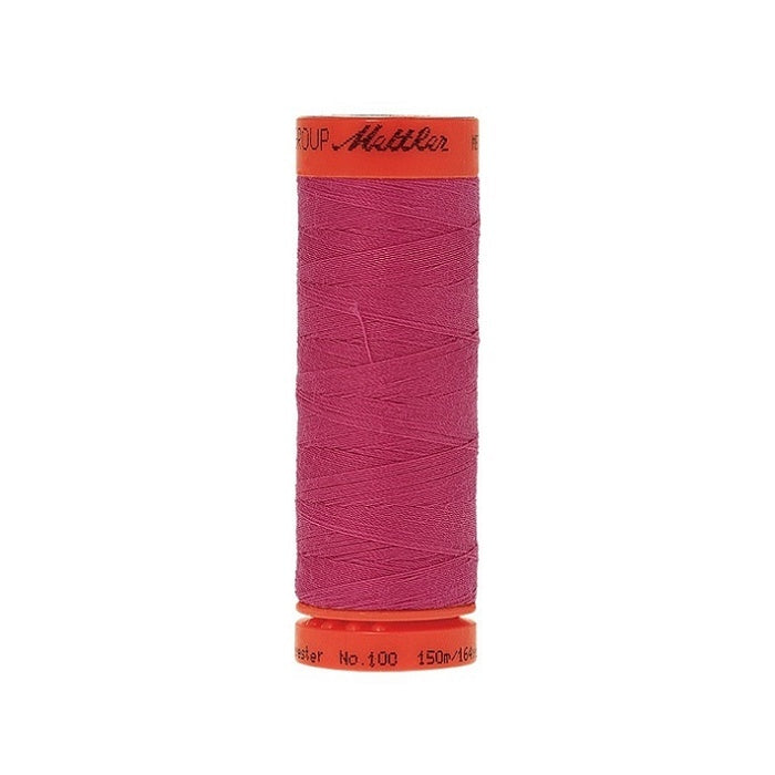 Spool of Mettler 150m hot pink thread.