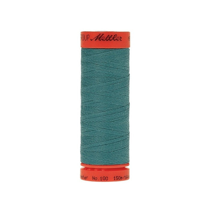 Spool of Mettler 150m teal thread.