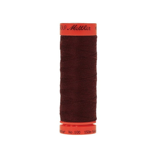 Spool of Mettler 150m dark brown thread.