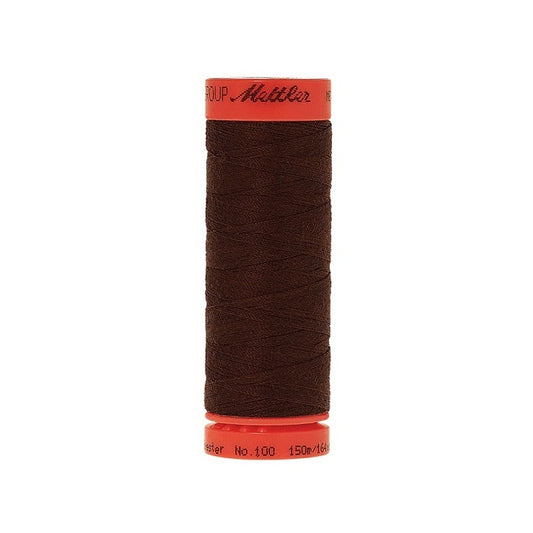 Spool of Mettler 150m dark brown thread.