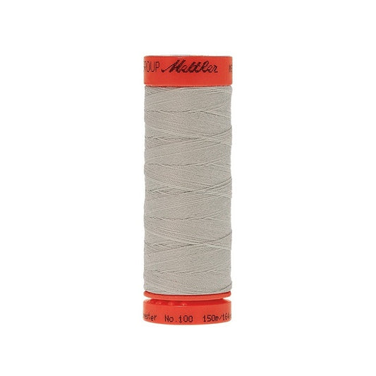 Spool of Mettler 150m light grey thread.