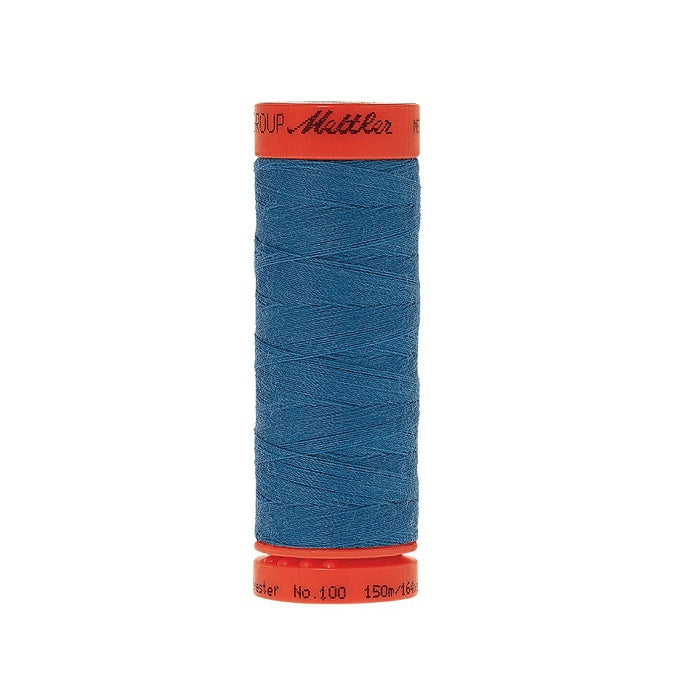 Spool of Mettler 150m blue thread.