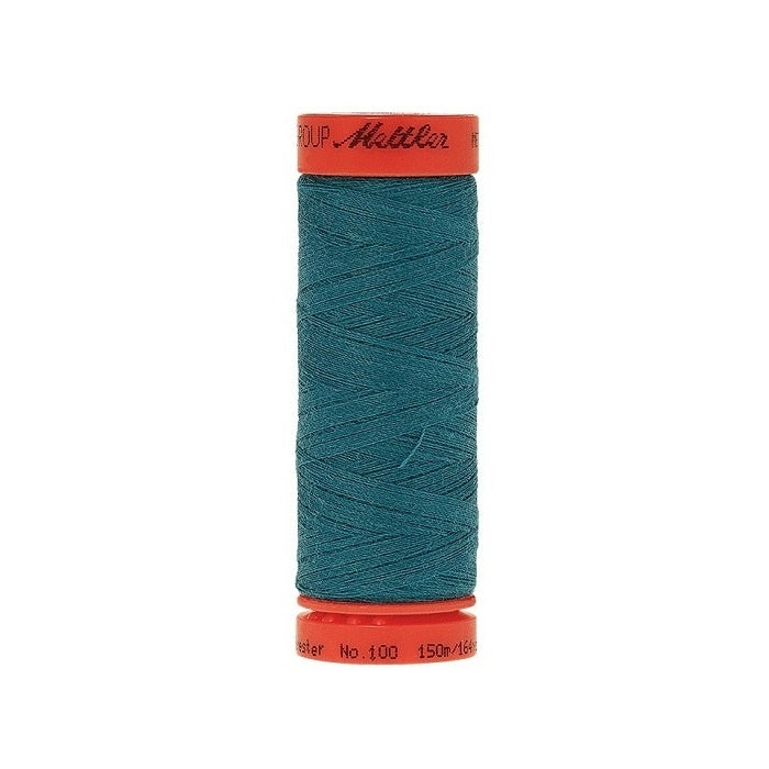 Spool of Mettler 150m teal thread.