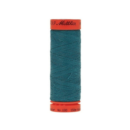 Spool of Mettler 150m teal thread.