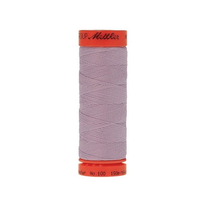 Spool of Mettler 150m lavender purple thread.