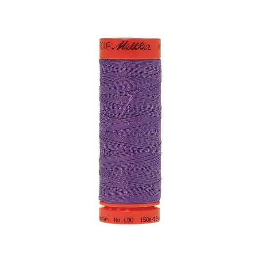 Spool of Mettler 150m dark lavender thread.