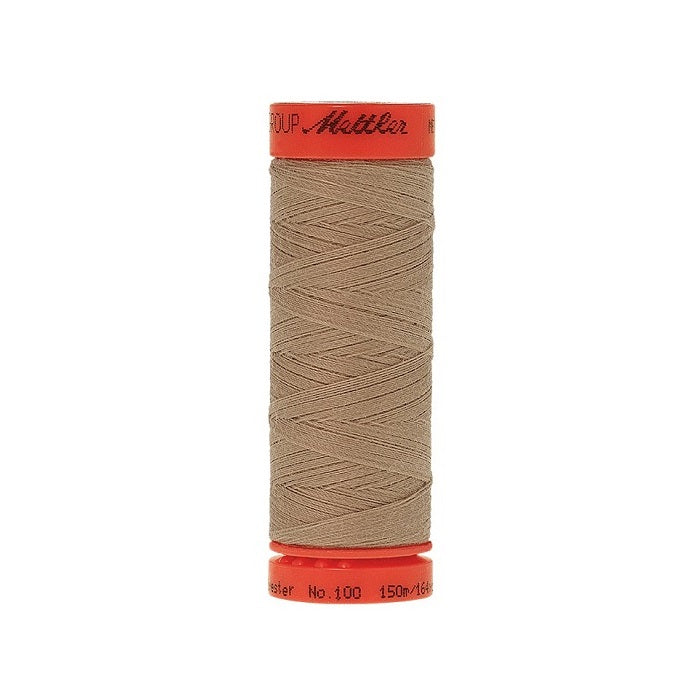 Spool of Mettler 150m beige thread.