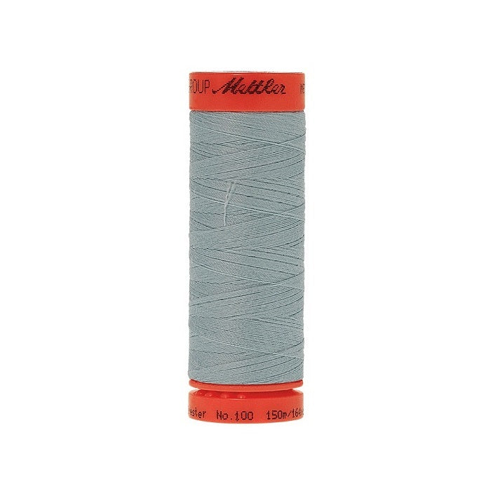 Spool of Mettler 150m light blue thread.