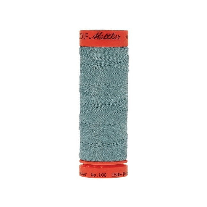 Spool of Mettler 150m teal blue thread.