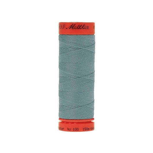 Spool of Mettler 150m teal blue thread.