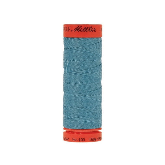 Spool of Mettler 150m turquoise blue thread.