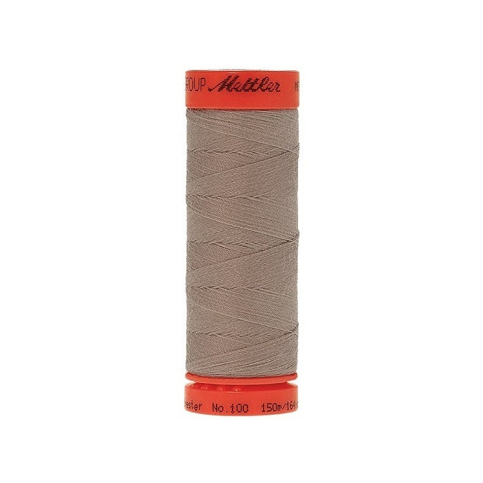 Spool of Mettler 150m light brown thread.