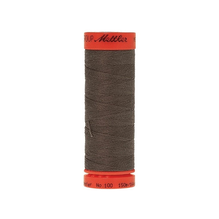 Spool of Mettler 150m dark grey thread.