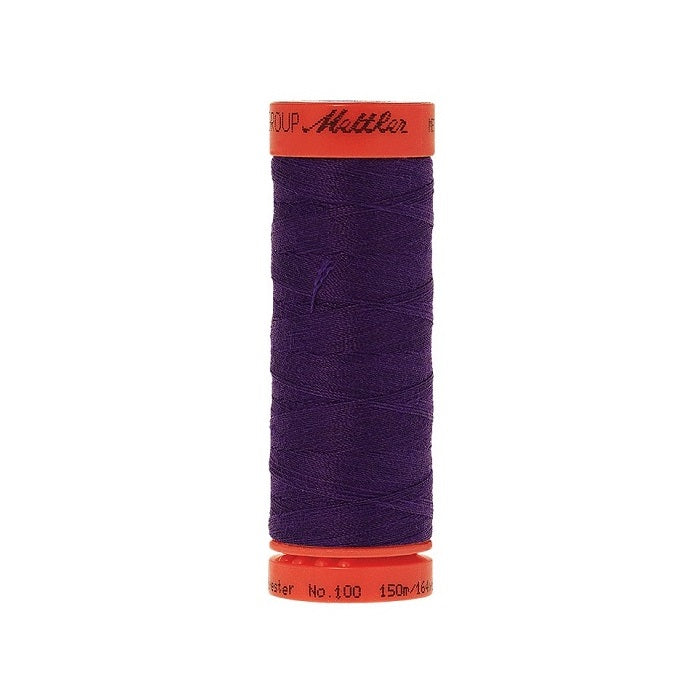 Spool of Mettler 150m dark purple thread.