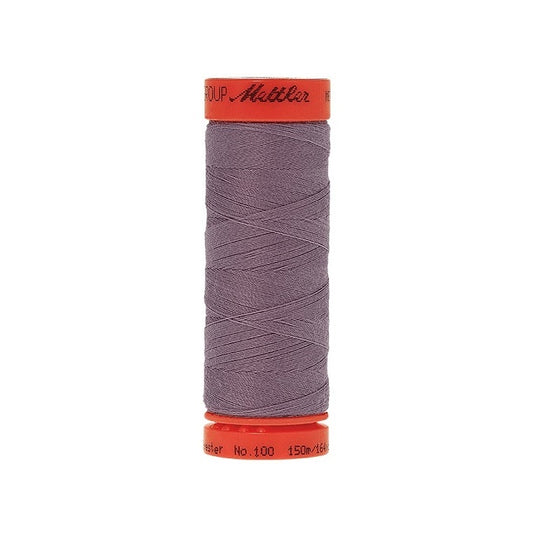 Spool of Mettler 150m purple grey thread.