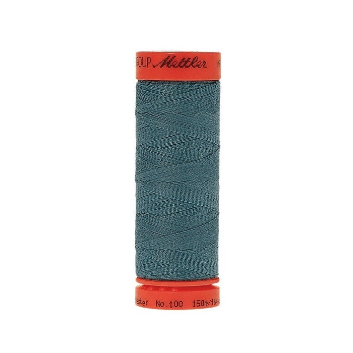 Spool of Mettler 150m teal blue green thread.