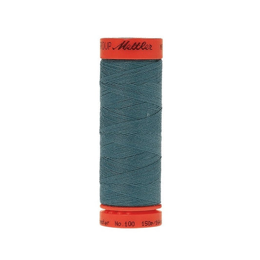 Spool of Mettler 150m teal blue green thread.
