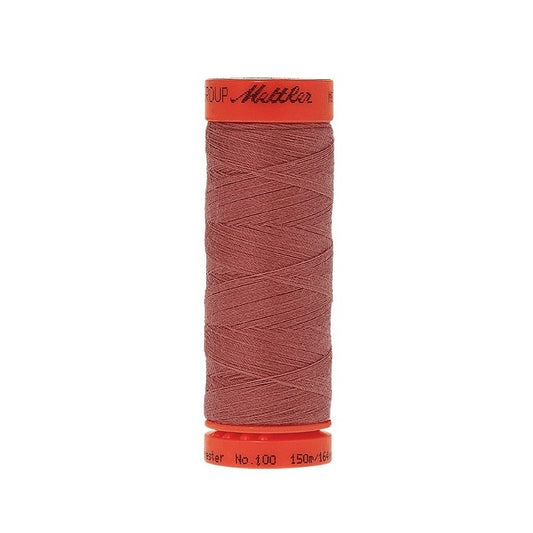 Spool of Mettler 150m dusky red thread.