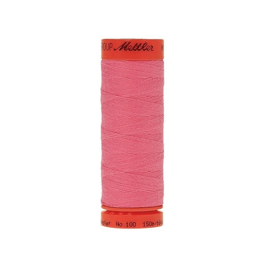 Spool of Mettler 150m pink thread.