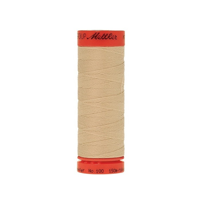 Spool of Mettler 150m beige thread.