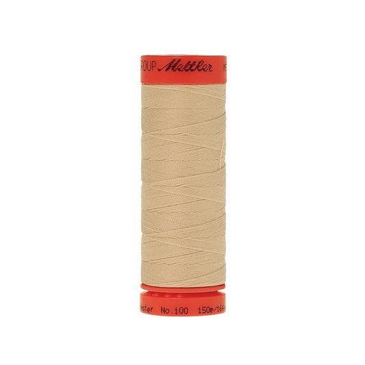 Spool of Mettler 150m beige thread.