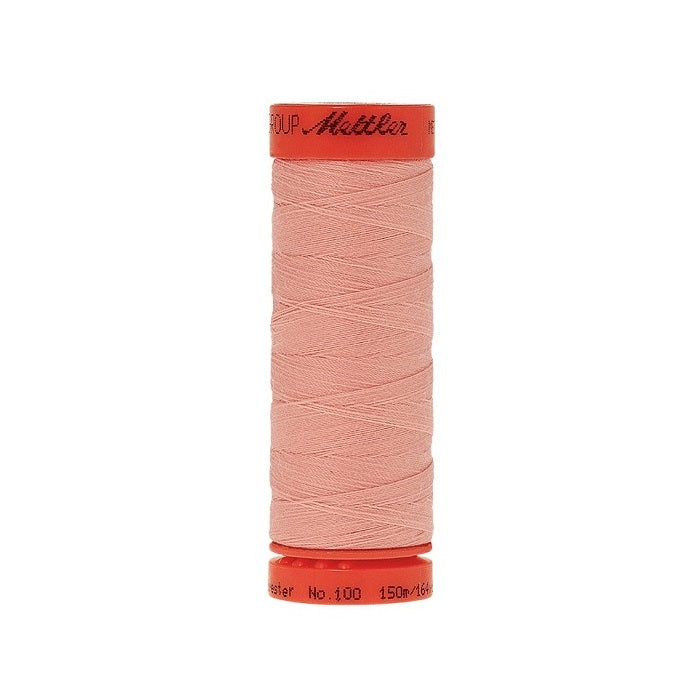 Spool of Mettler 150m pink thread.