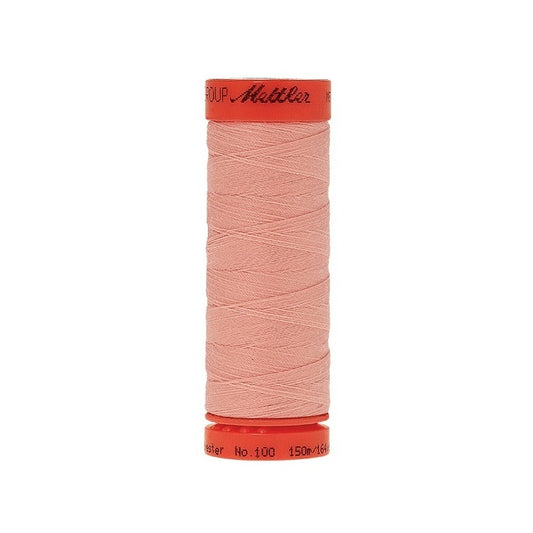 Spool of Mettler 150m pink thread.