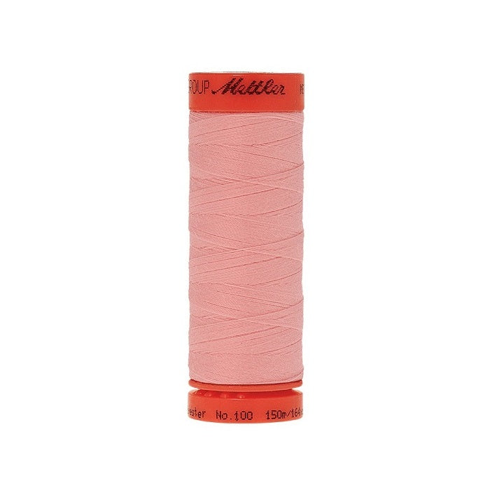 Spool of Mettler 150m pink thread.