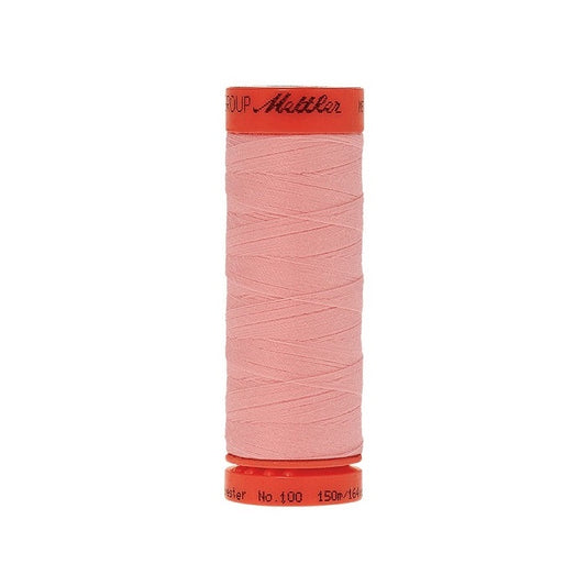 Spool of Mettler 150m pink thread.