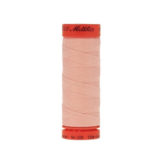 Spool of Mettler 150m pink thread.