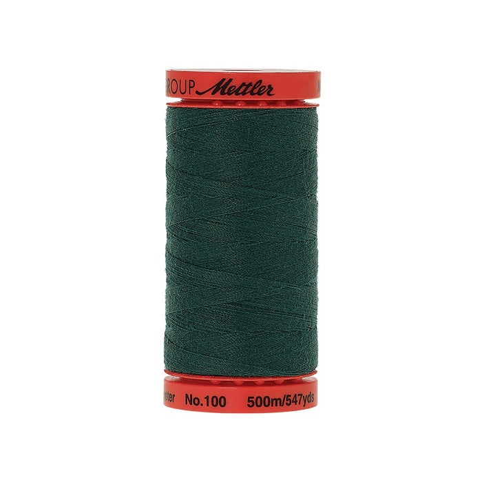 Spool of Mettler 500m dark green thread.