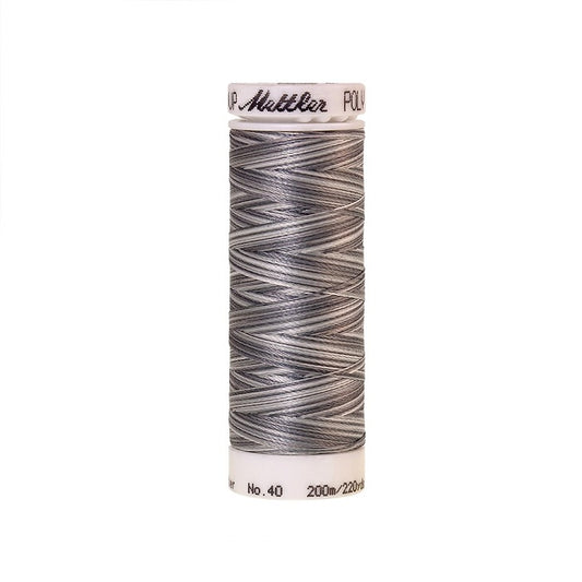 Spool of Mettler silver and grey variegated thread.
