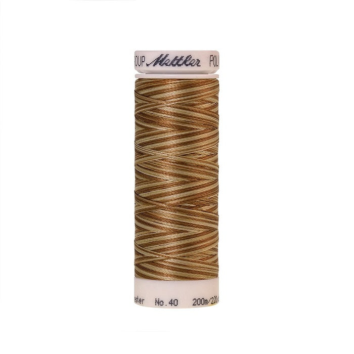 Spool of Mettler brown and beige variegated thread.