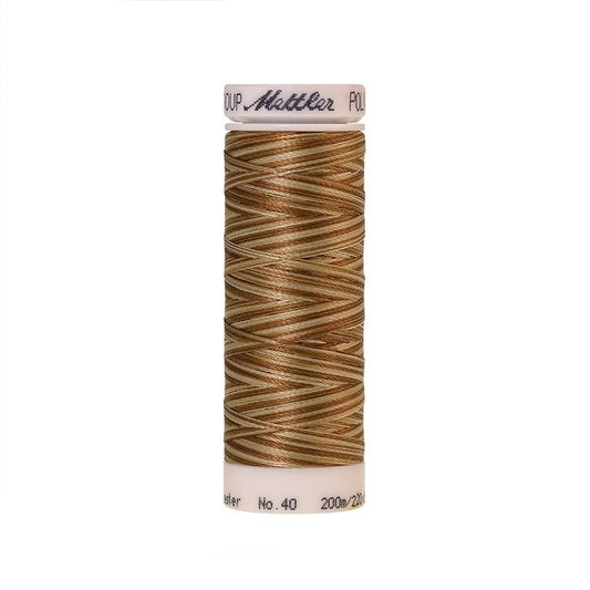 Spool of Mettler brown and beige variegated thread.