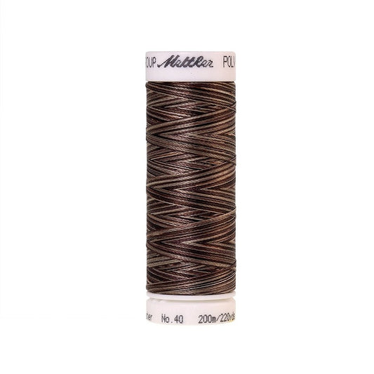 Spool of Mettler brown variegated thread.