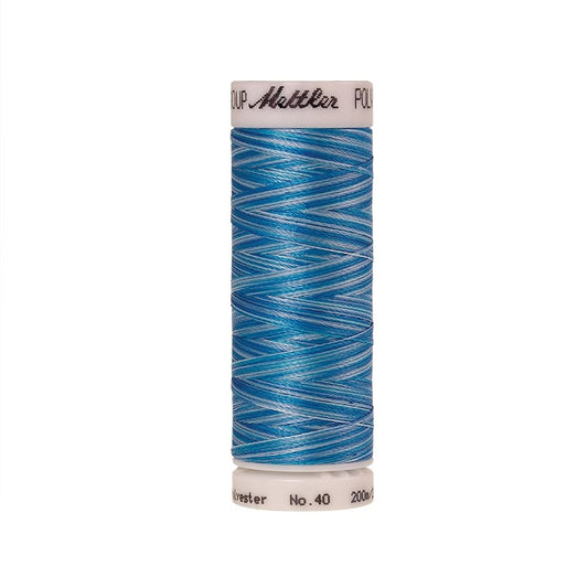Spool of Mettler blue variegated thread.