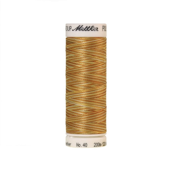 Spool of Mettler gold variegated thread.