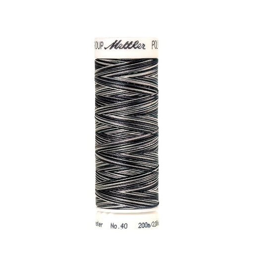 Spool of Mettler black and white variegated thread.