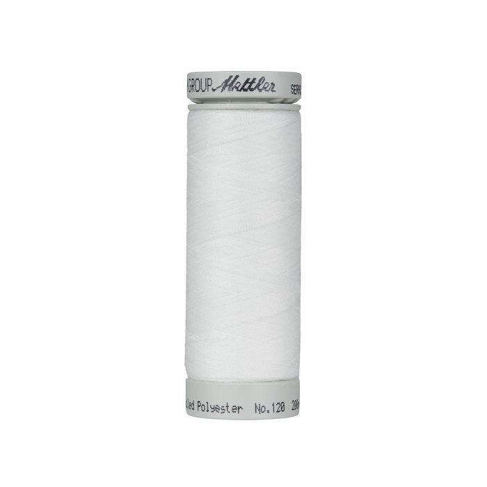 Spool of off white thread with Mettler Seracycle branding.