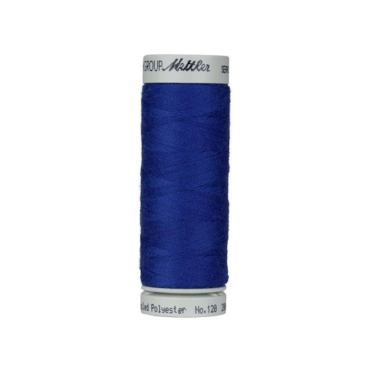 Spool of dark blue thread with Mettler Seracycle branding.