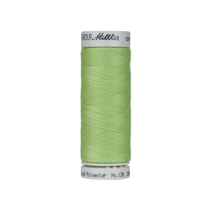 Spool of light green thread with Mettler Seracycle branding.