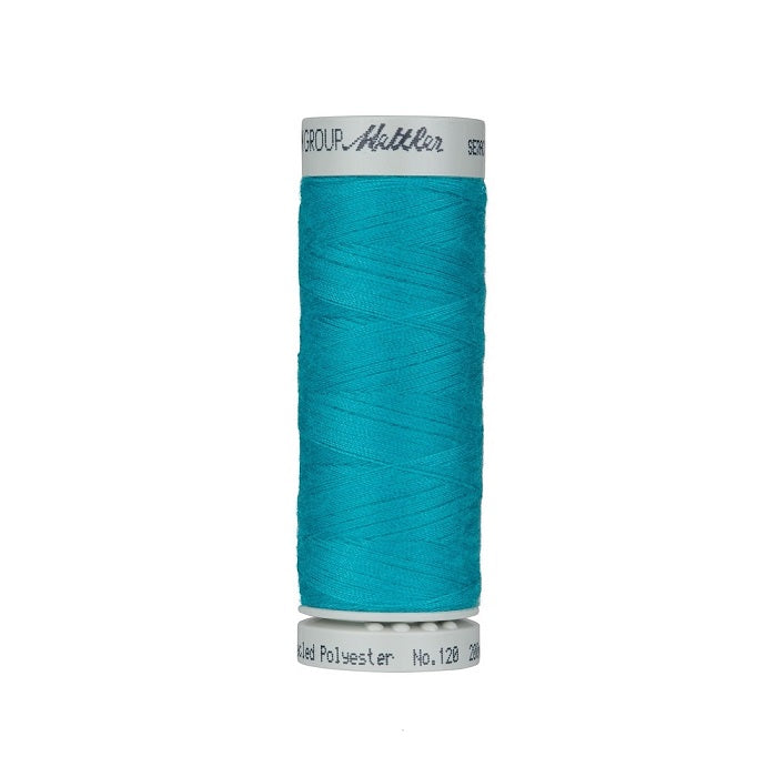 Spool of blue thread with Mettler Seracycle branding.