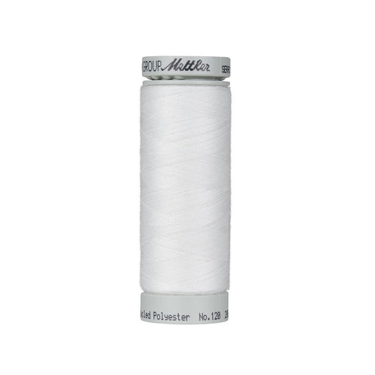 Spool of white thread with Mettler Seracycle branding.