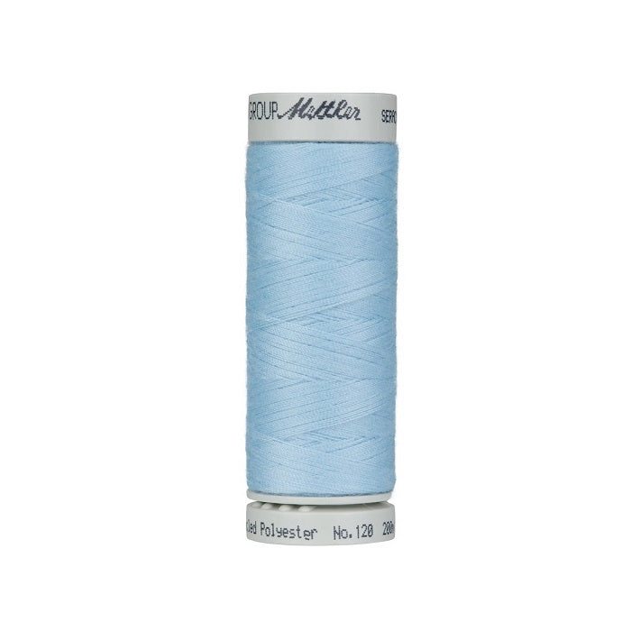 Spool of light blue thread with Mettler Seracycle branding.