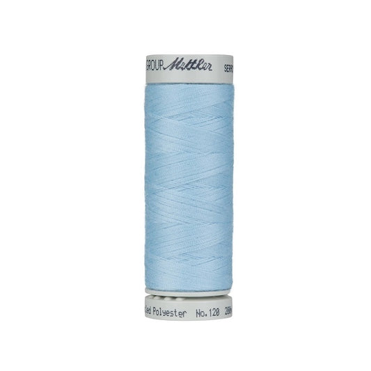 Spool of light blue thread with Mettler Seracycle branding.
