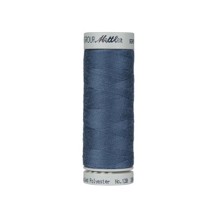 Spool of blue thread with Mettler Seracycle branding.