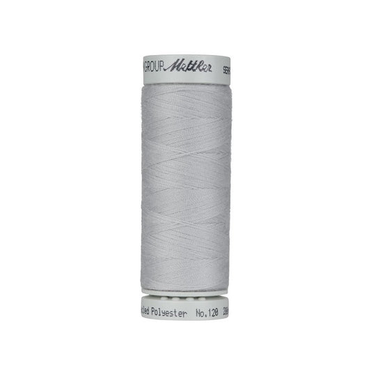Spool of grey thread with Mettler Seracycle branding.