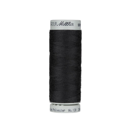 Spool of very dark grey thread with Mettler Seracycle branding.