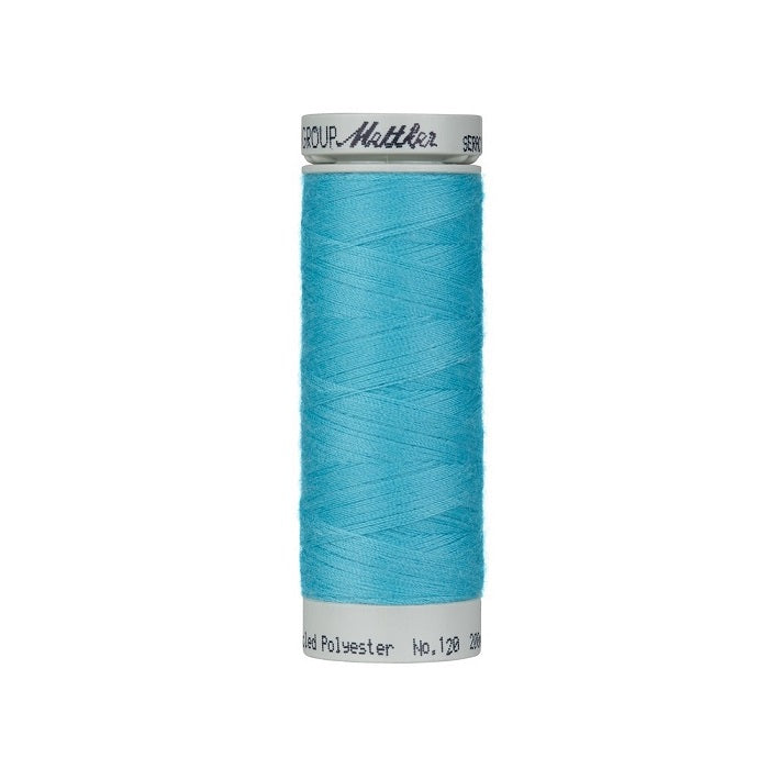 Spool of blue thread with Mettler Seracycle branding.