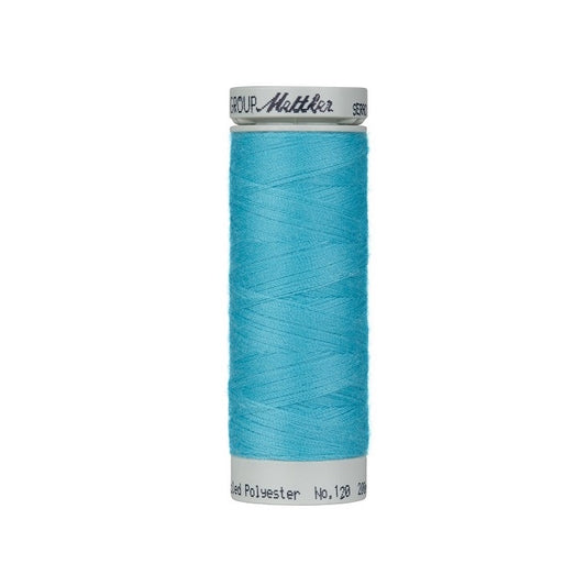 Spool of blue thread with Mettler Seracycle branding.